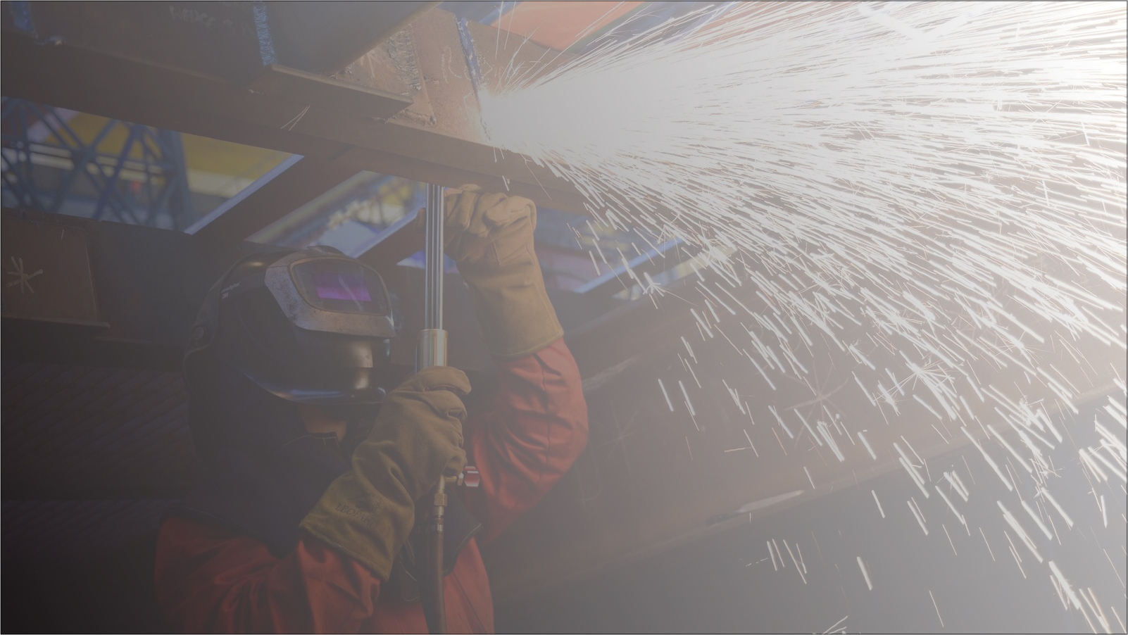 Welder working on a large steel structure