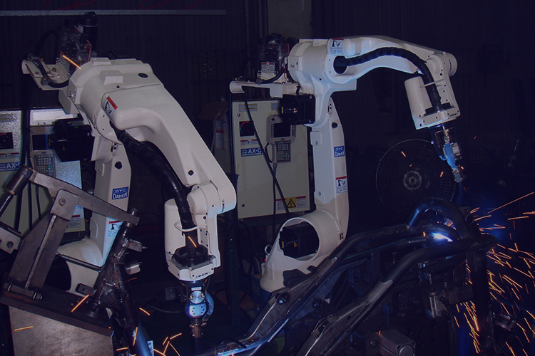 Technician using a Telwin welding system during vehicle repair